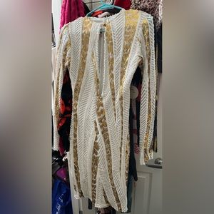 Sexy open long sleeve white and gold midi dress.